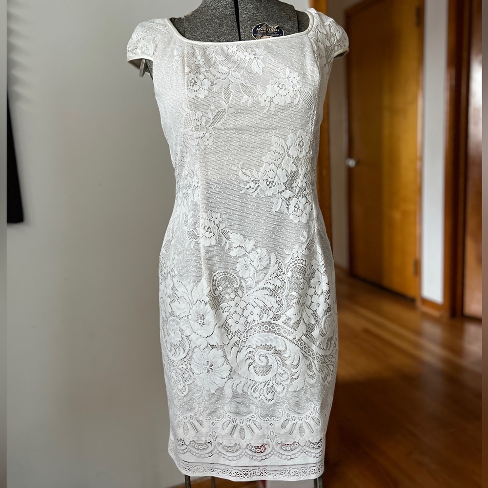 White shimmer underlay lace overlay zip up shirt sleeve dress